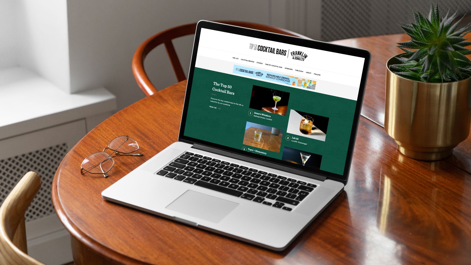 Mock-up image of the top 50 cocktail bars homepage on a laptop
